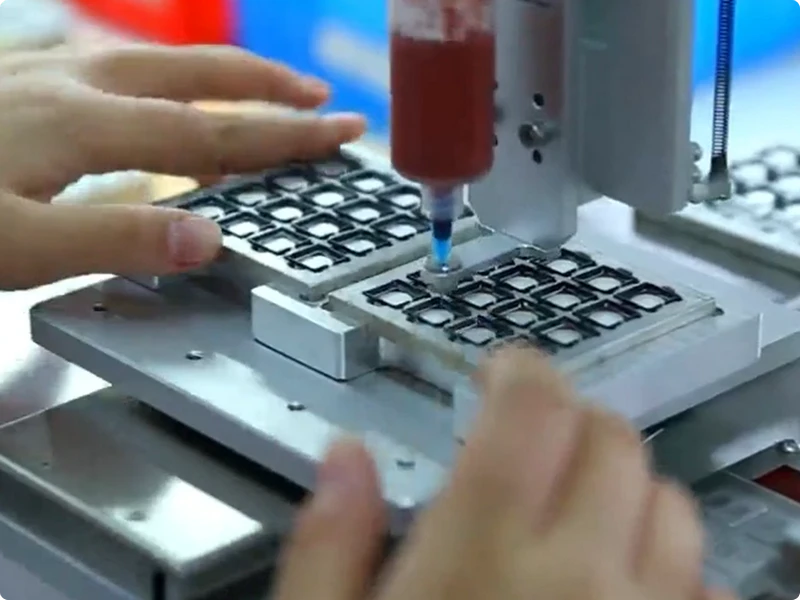 Precision dispensing and assembly detail at RYD production station